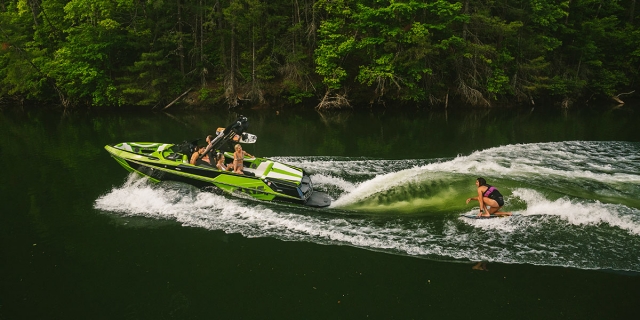 A wakeboarder rides behind an Axis T22