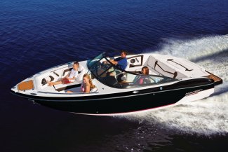 The Monterey 238 Super Sport boat cruising the water with a happy family.