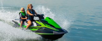 a mother and daughter have fun on a yamaha waverunner vx deluxe.